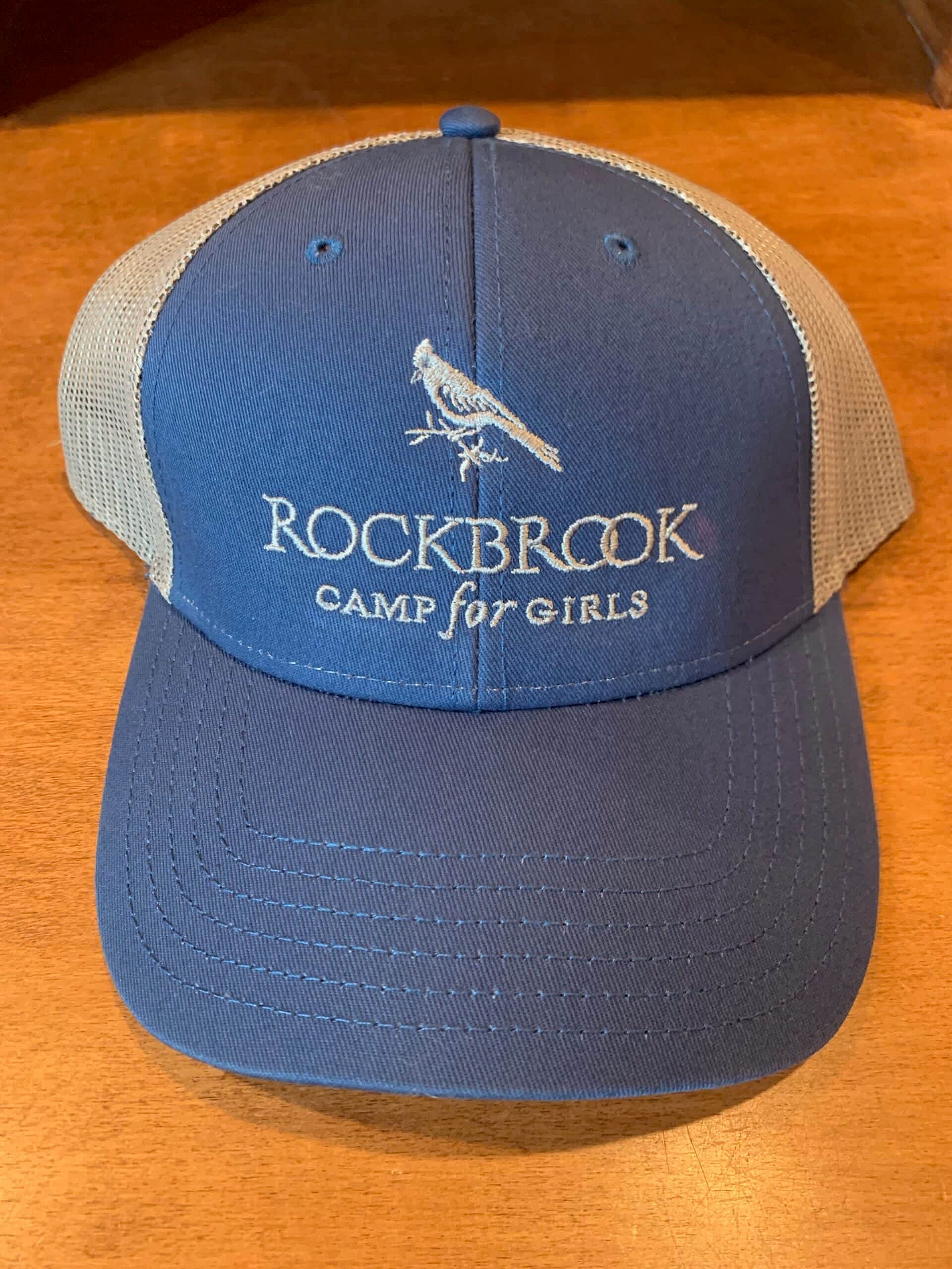 blue trucker hat with white Rockbrook logo