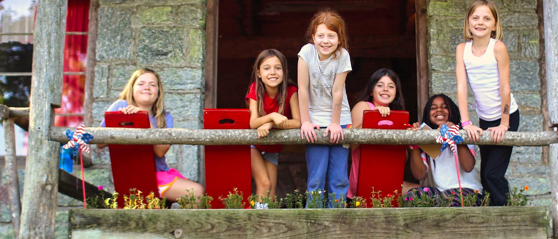 young camp girls on porch