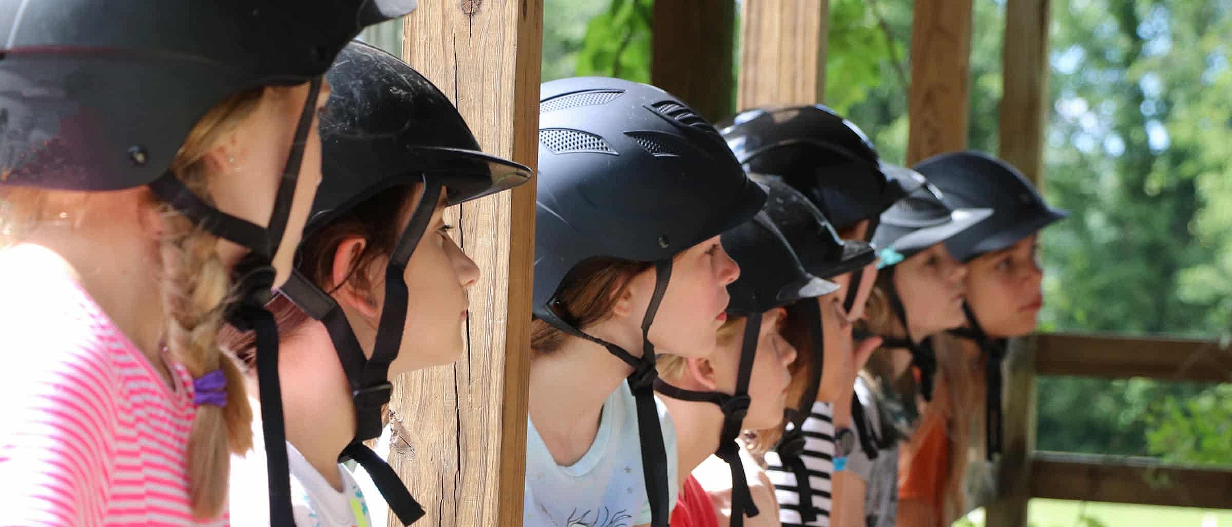 summer camp horseback riders in class