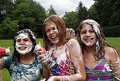 Girls laughing at shaving cream fight