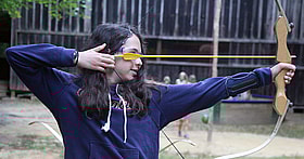 Girl Archer at camp