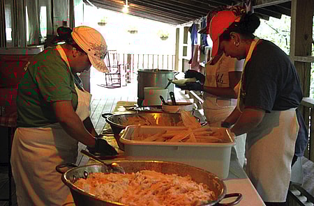 Making authentic corn tamales at camp