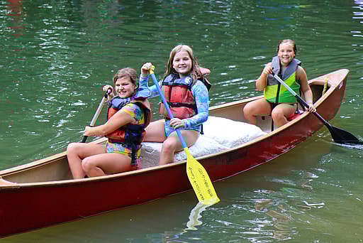 summer camp learning canoeing