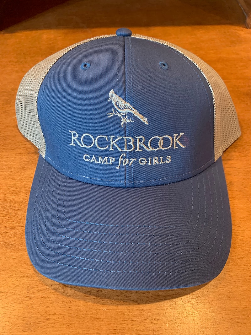 blue trucker hat with white Rockbrook logo