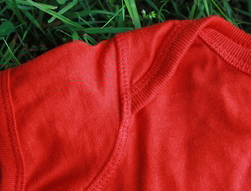red onesie shoulder detail