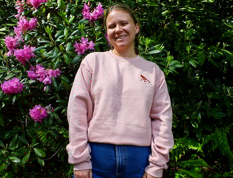 light pink sweatshirt modeled