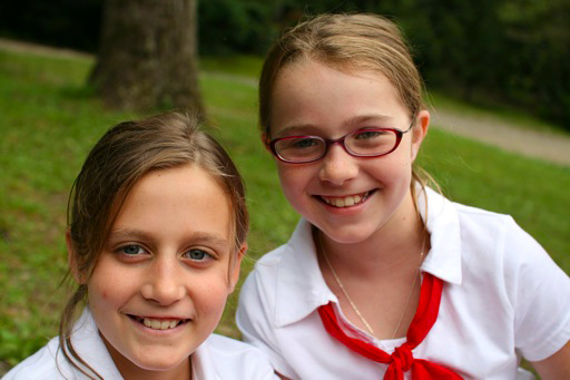 child with glasses at camp