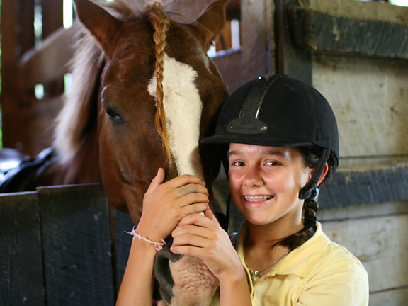 pretty girl smiling with braided horse