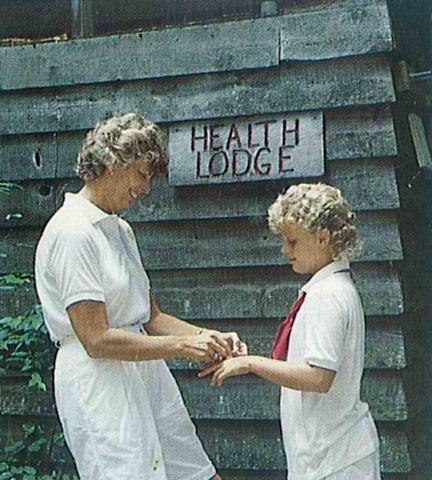 Camp Nurse helping girl