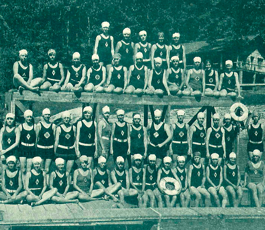 girls camp swim team posing