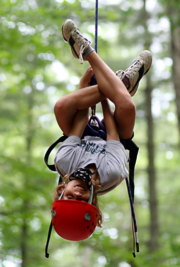 Kids learning to rock climb while at camp