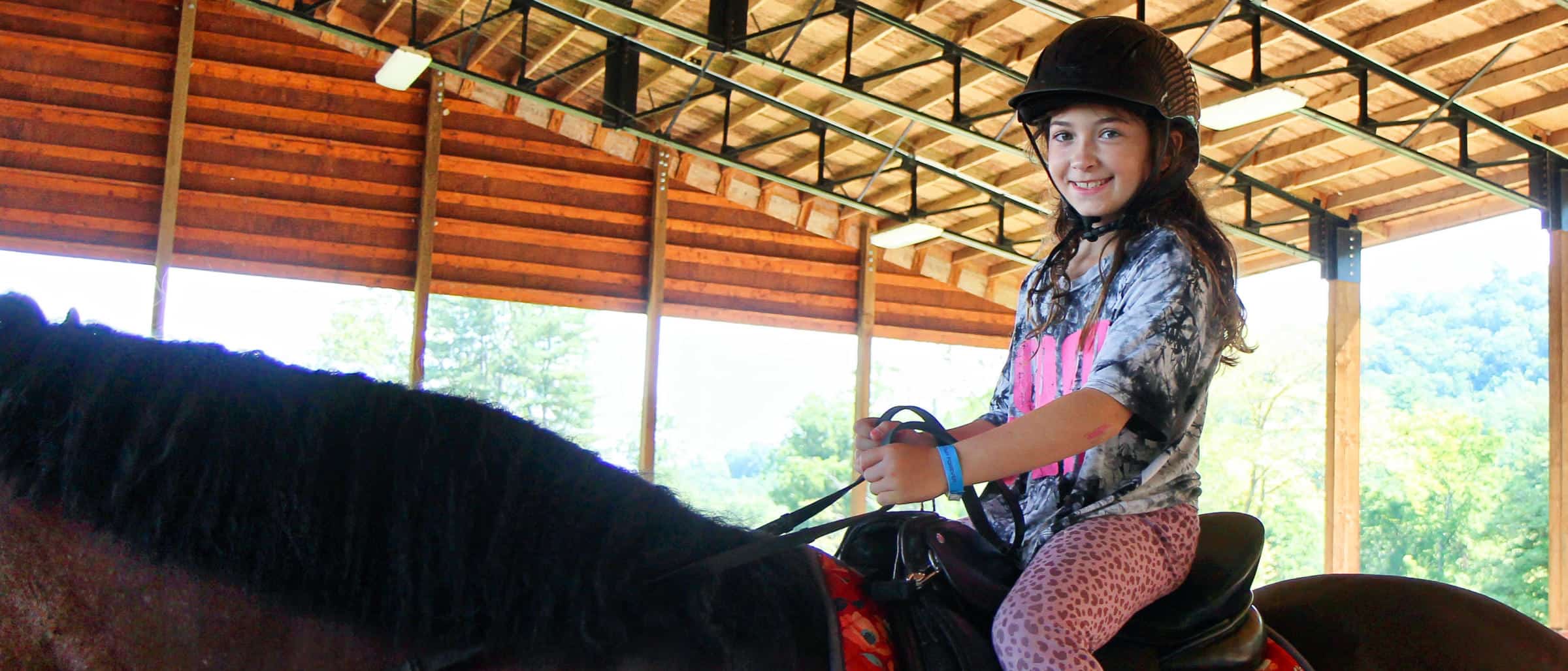 A confident equestrienne at summer camp
