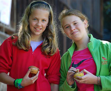 girls eating muffins at summer camp