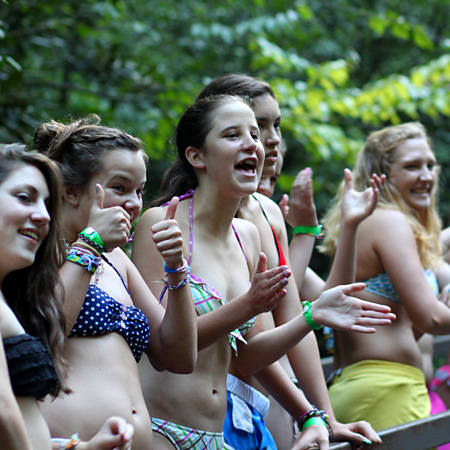 girls cheering their friends on sliding rock