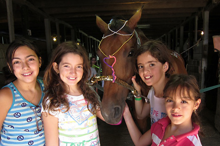 Campers decorate a horse