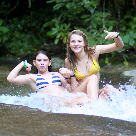 girls showing power on sliding rock