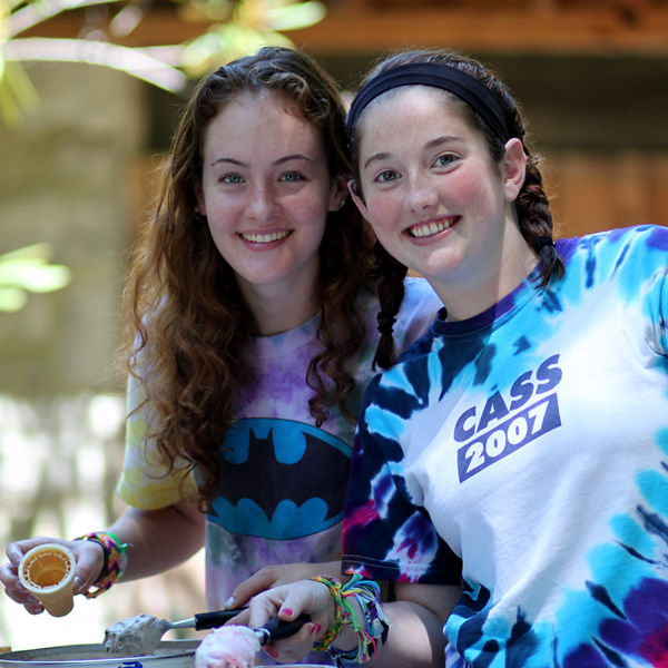 Two girls being camp counselors