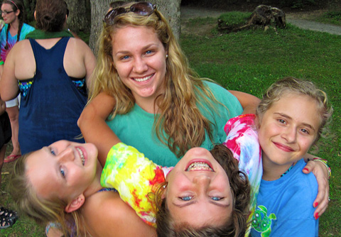 Camp Counselor Hugs Campers