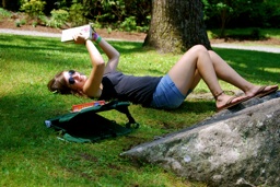 relaxing reading in the grass