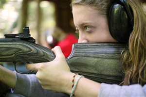 Camp girl shooting a rifle