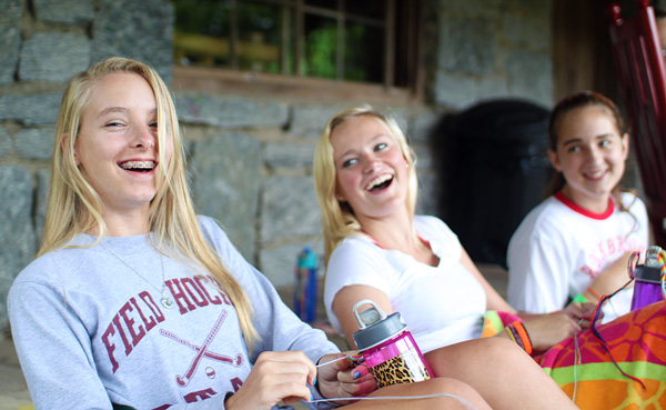 Teen girls happy and laughing at summer camp
