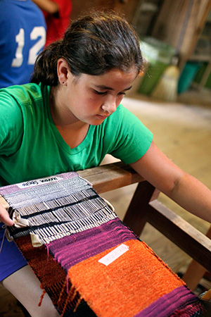 Camp girl show success on loom weaving