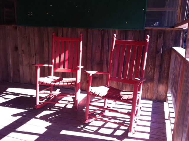 red rocking chairs at camp