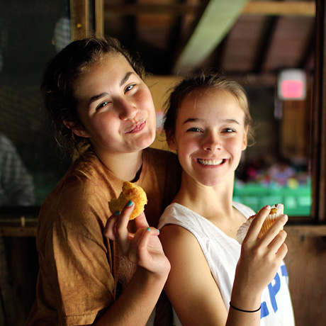 Camp friends eating a fresh muffin