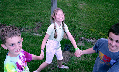 Children at summer camp square dancing