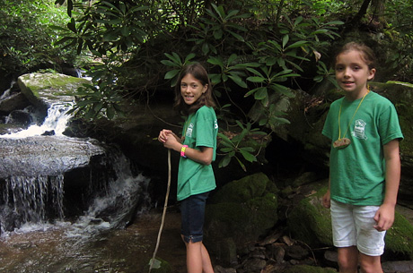 Girls finding a waterfall on hike