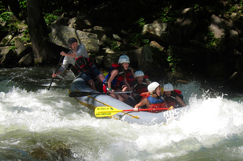 Camp kids whitewater rafting trip