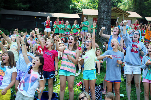 Cheering girls at camp assembly