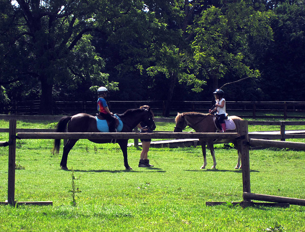 Camp horseback riding lesson for girls