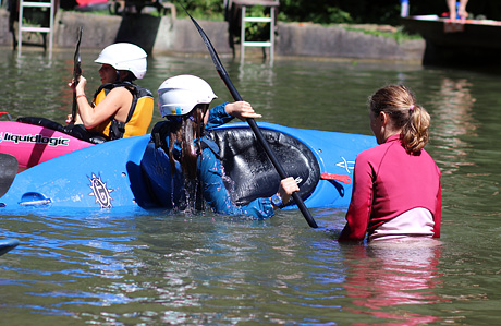 Learning to roll a whitewater kayak