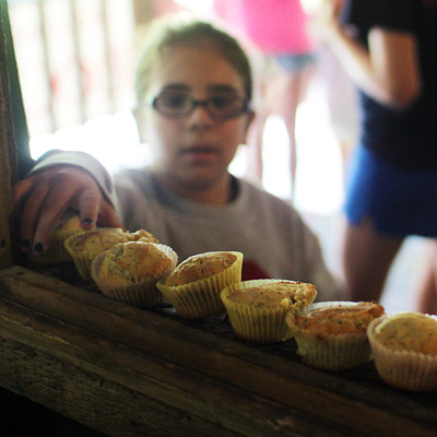 Camp kid eating a fresh muffin