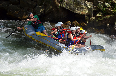 Girls Whitewater rafting rapid