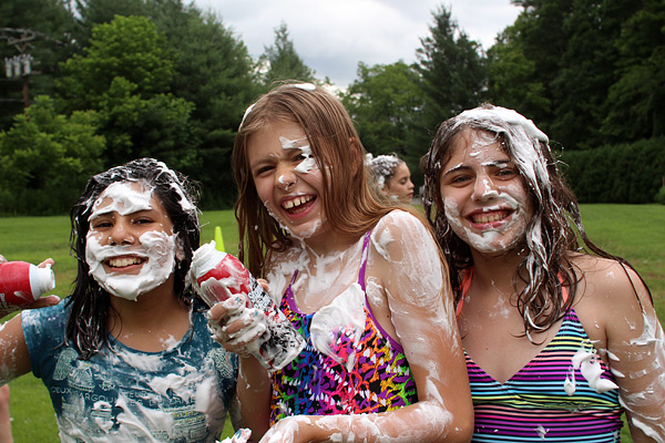 Girls laughing at shaving cream fight