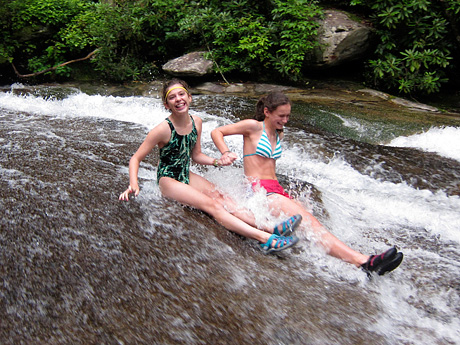 2 camp girls taking a ride down sliding rock