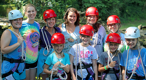 Crew of girls ready for the camp zip line