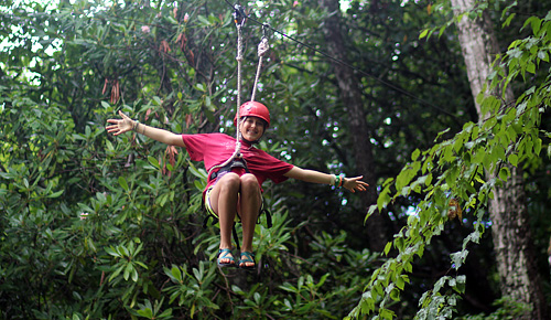 Camp girl riding zip line