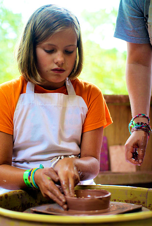 girl's wheel ceramics at camp