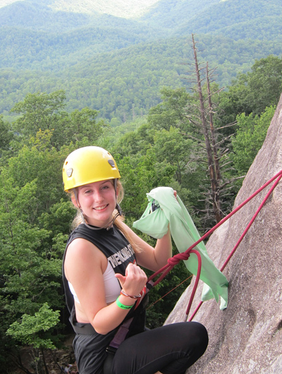 Kid climbing Sundial route of Looking Glass Rock in North Carolina