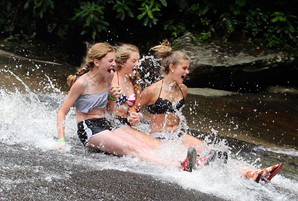 Girls Sliding Down the Rock