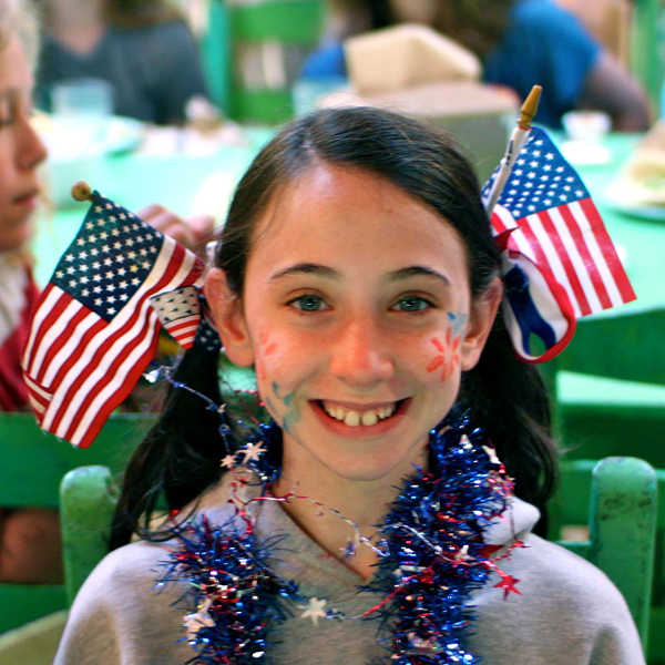 USA Flag in Hair of Girl Camper