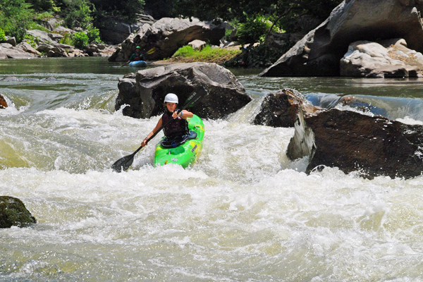 Camp Girl whitewater kayaking on the nolichucky