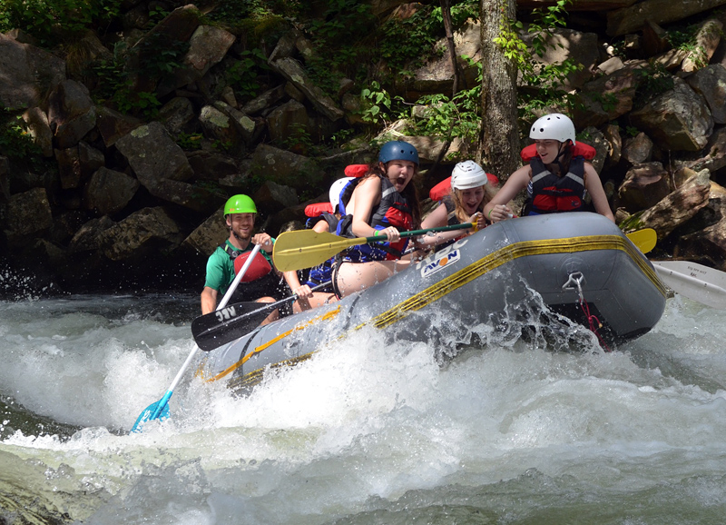 Girls camp rafting whitewater rapid