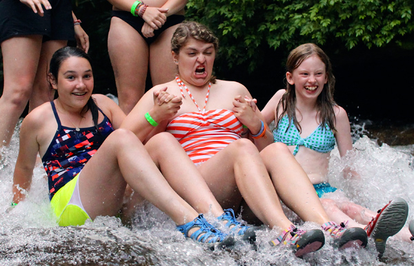 Girls Grimacing on Sliding Rock