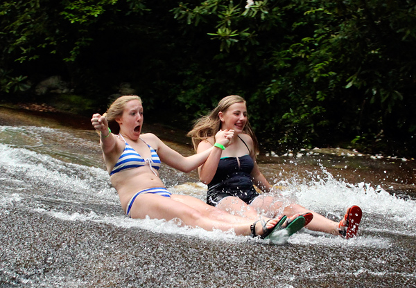 Girls grinning on sliding rock