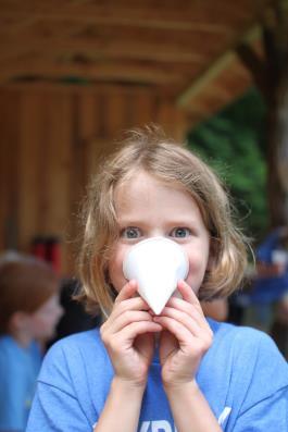 paper cone mask on girl's nose