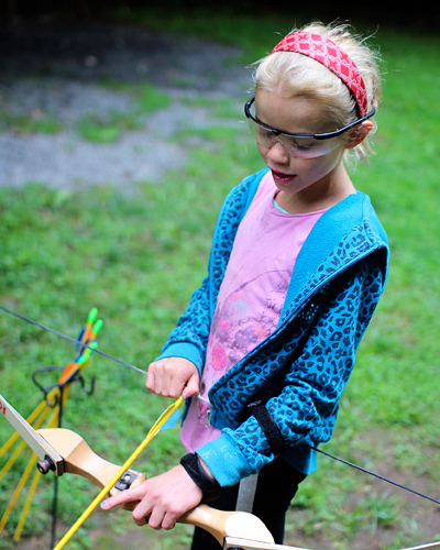 Camp kid shooting archery